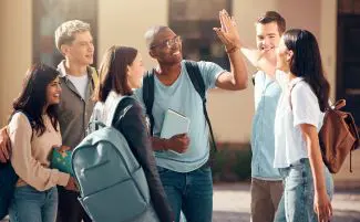 University, friends and student high five of diversity, college and education group outdoor. Students, study and success support hand gesture of people with happiness excited about learning goal.